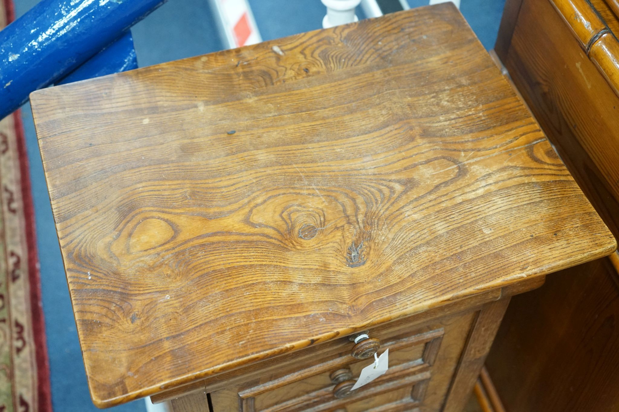 A 19th century French elm bedside cabinet with dummy drawer front, width 47cm, depth 36cm, height 76cm